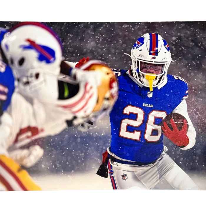 Ty Johnson Unsigned Ball in Snow 8x10 Photo