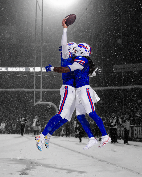 Unsigned Josh Allen and James Cook Jumping Celebration in Snow Spotlight Photo